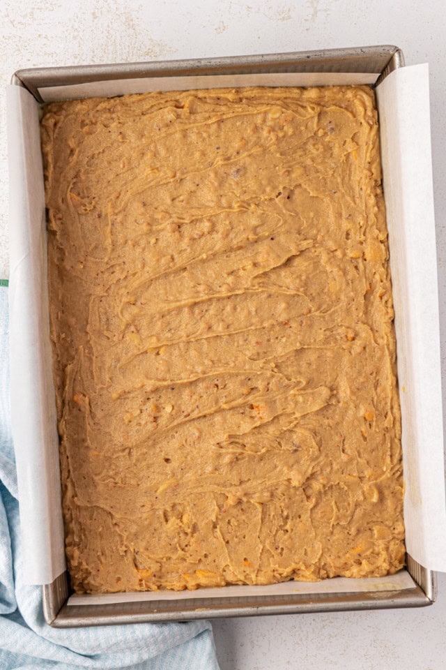 overhead view of brown butter blondies in a 9x13 baking pan ready to go into the oven