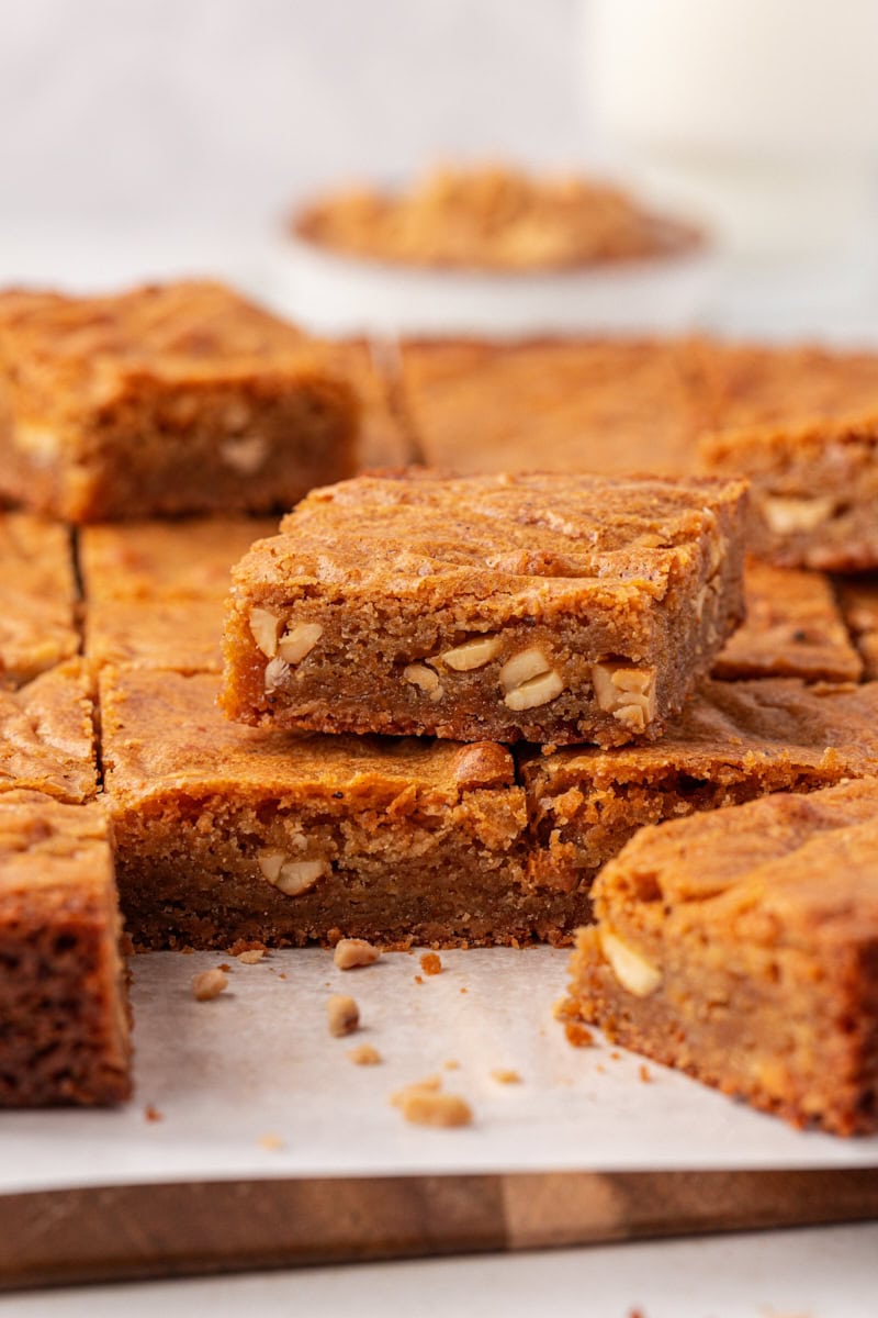 brown butter blondies on a parchment-lined cutting board