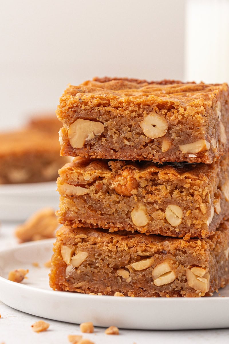stack of three brown butter blondies on a white plate