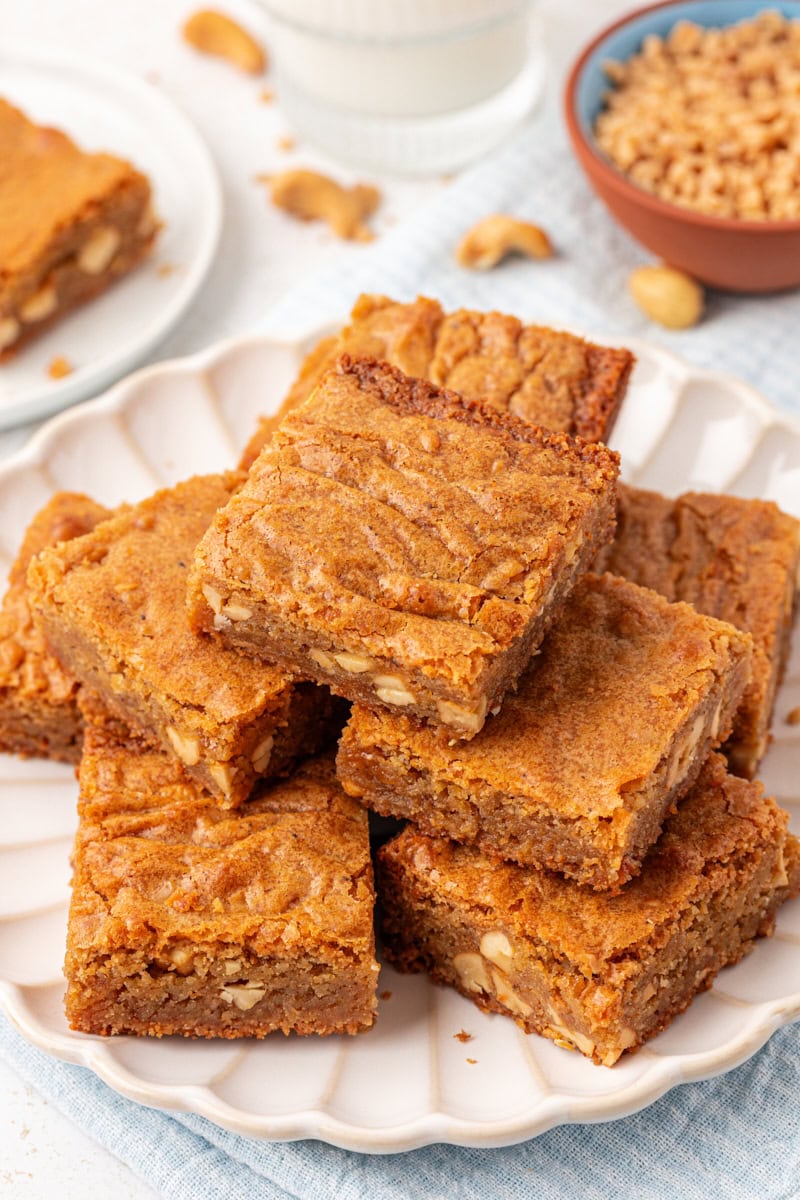 brown butter blondies in a stacked pile on a white plate