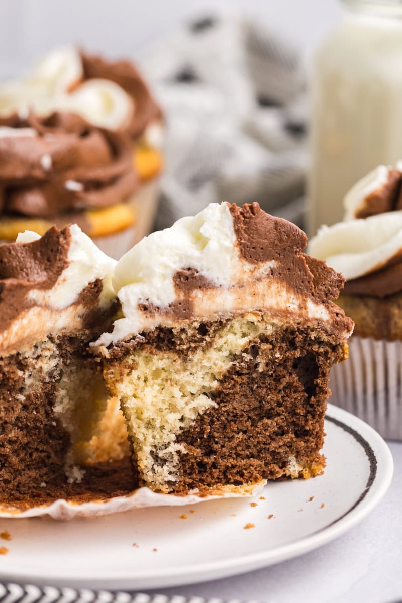 a marble cupcake cut in half to show the marbling effect