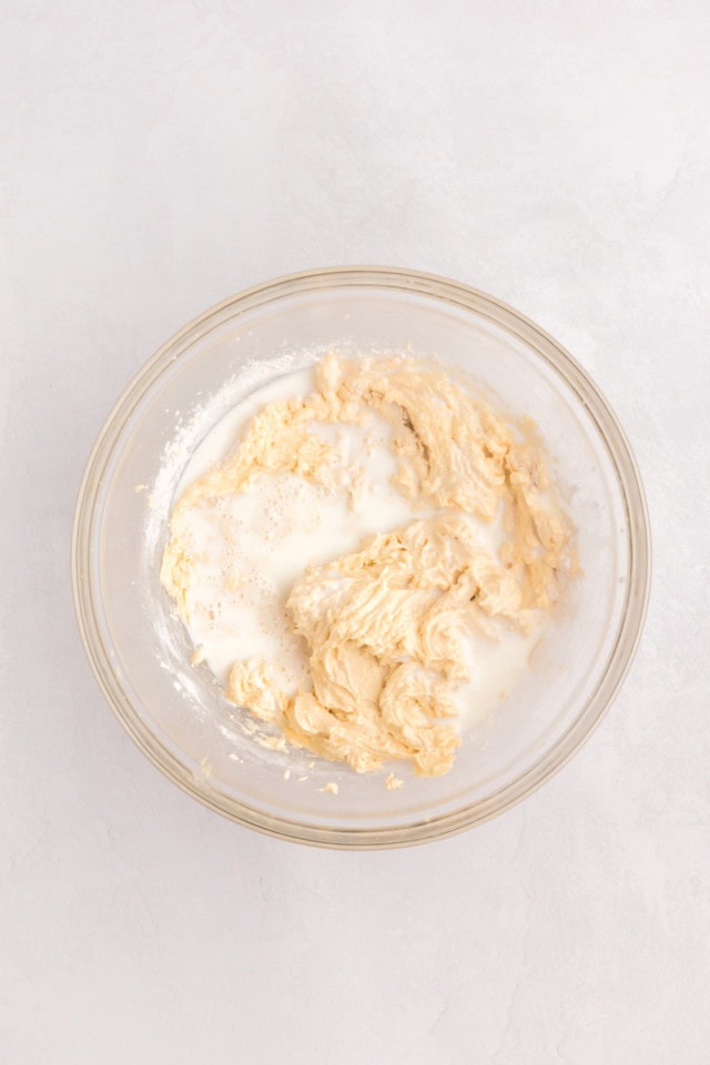 overhead view of buttermilk added to cupcake batter