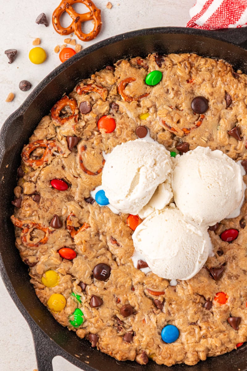 overhead view of a monster skillet cookie topped with three scoops of ice cream