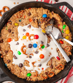 overhead view of monster skillet cookie topped with melting vanilla ice cream