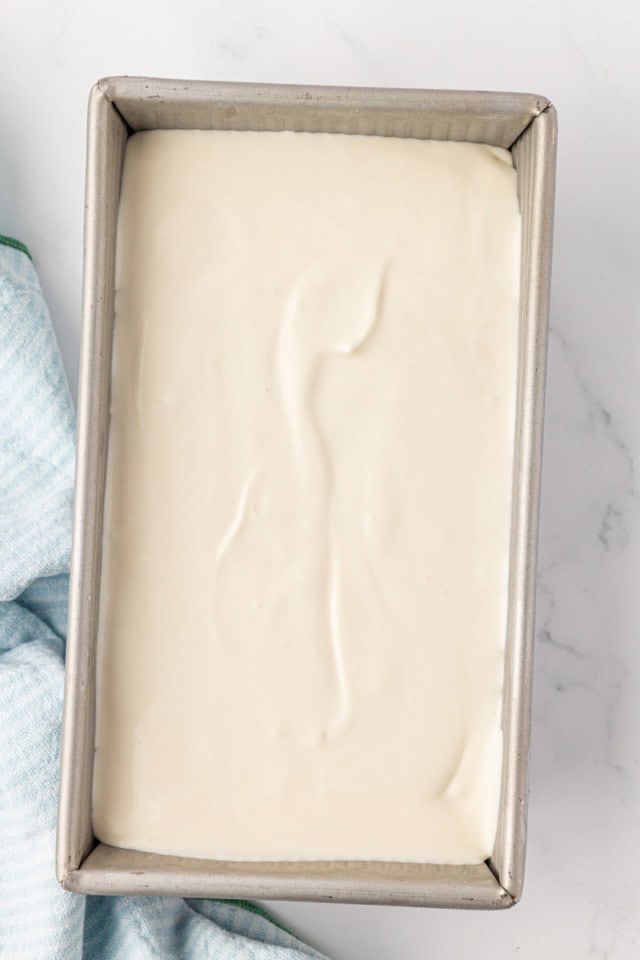 overhead view of vanilla ice cream in a metal loaf pan