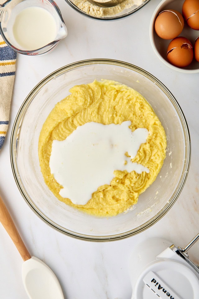 overhead view of buttermilk added to pound cake batter