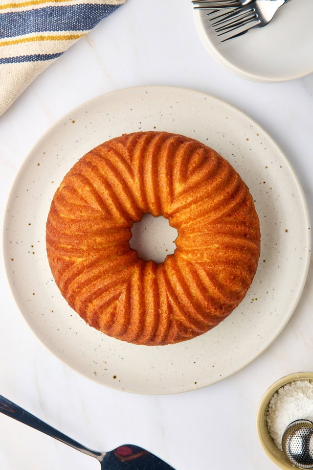 overhead view of cornmeal pound cake on a white cake plate