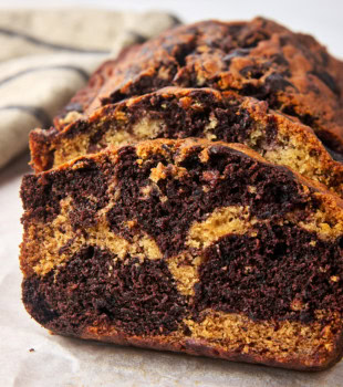 slices of marbled chocolate banana bread on parchment paper