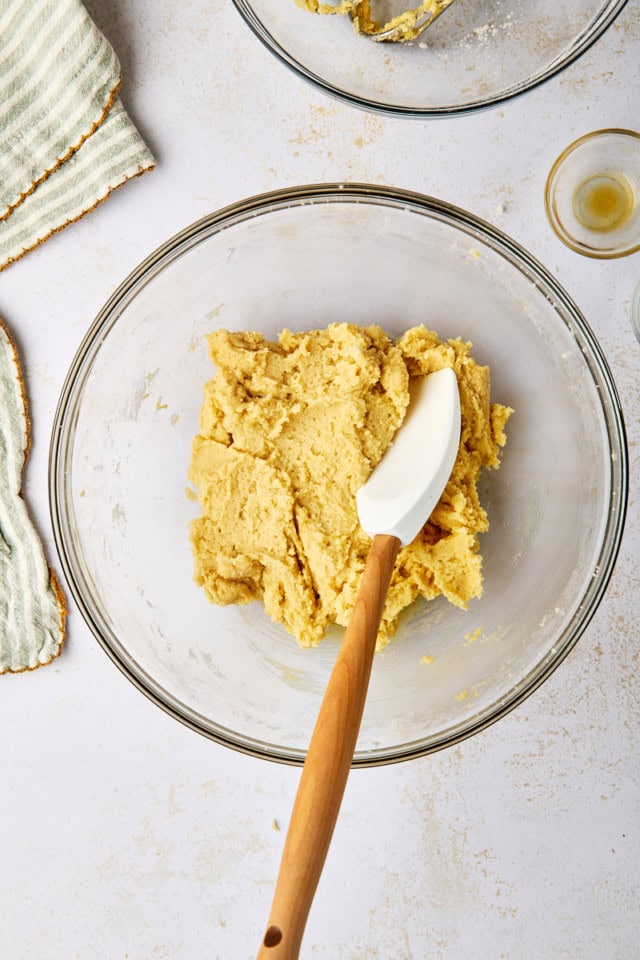 overhead view of sugar cookie dough in a glass mixing bowl