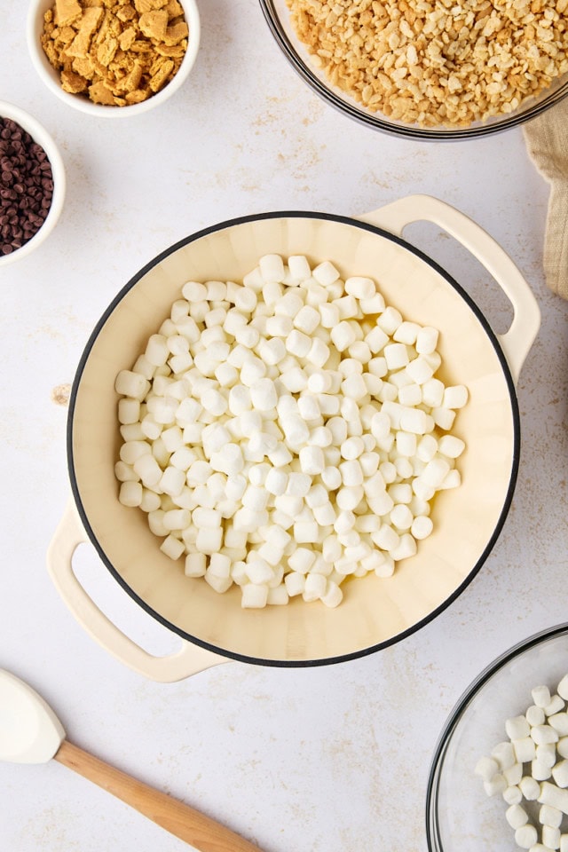 overhead view of mini marshmallows added to melted butter in a saucepan