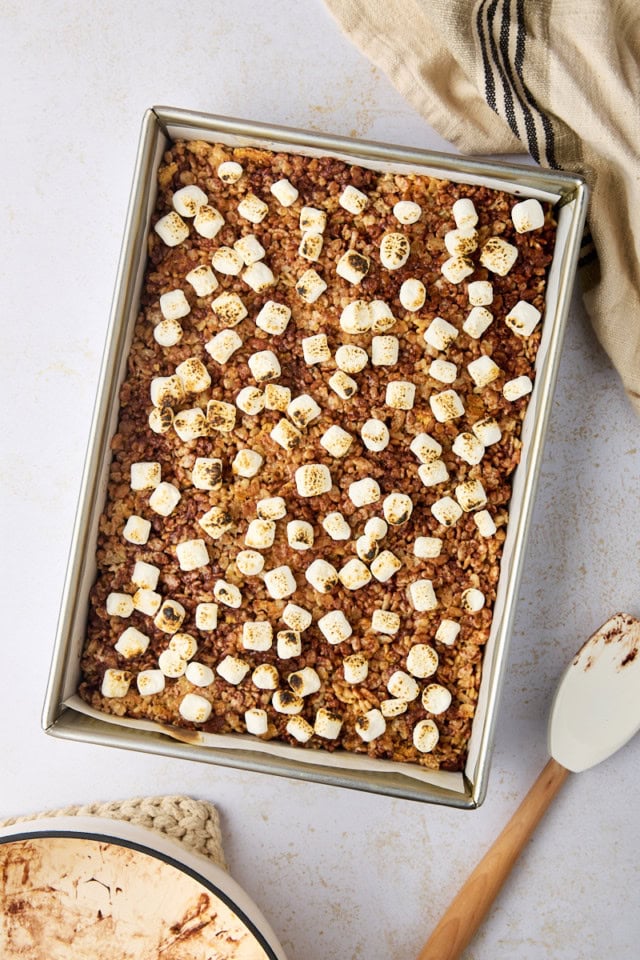 overhead view of s'mores rice crispy treats with mini marshmallows toasted on top