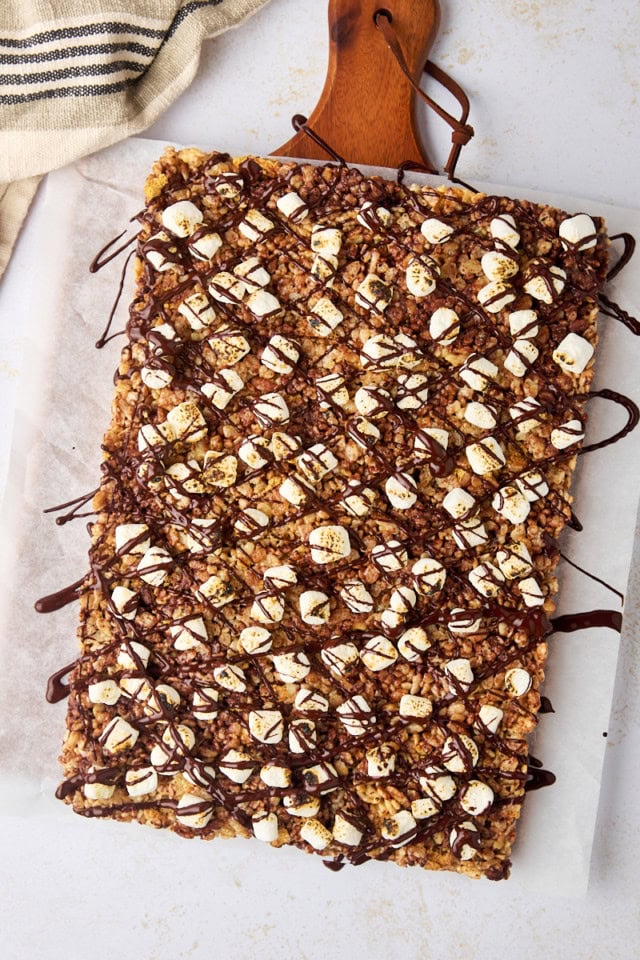 overhead view of s'mores rice crispy treats topped with chocolate drizzle