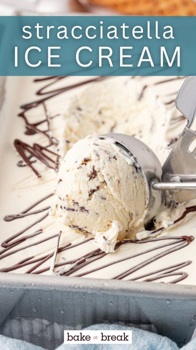 a scoop of stracciatella ice cream resting on top of more ice cream; text overlay "stracciatella ice cream"