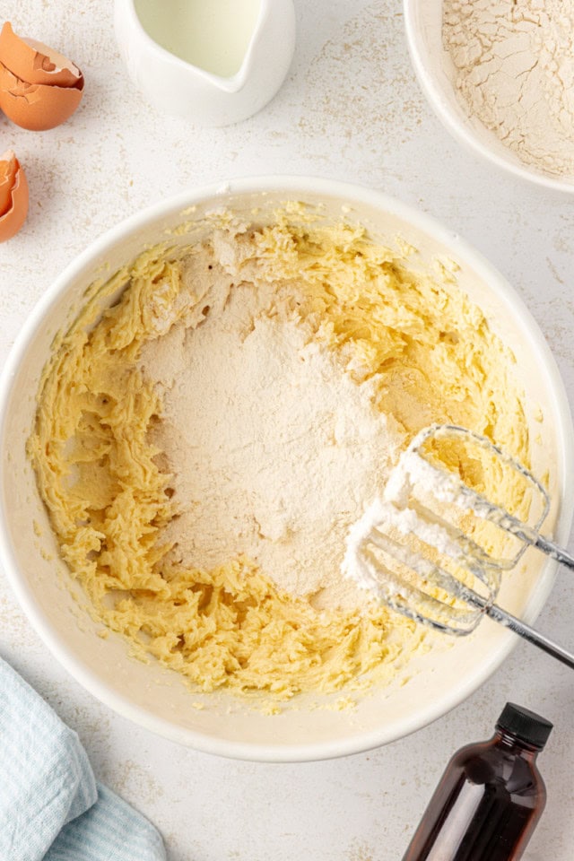 overhead view of dry ingredients added to cake batter