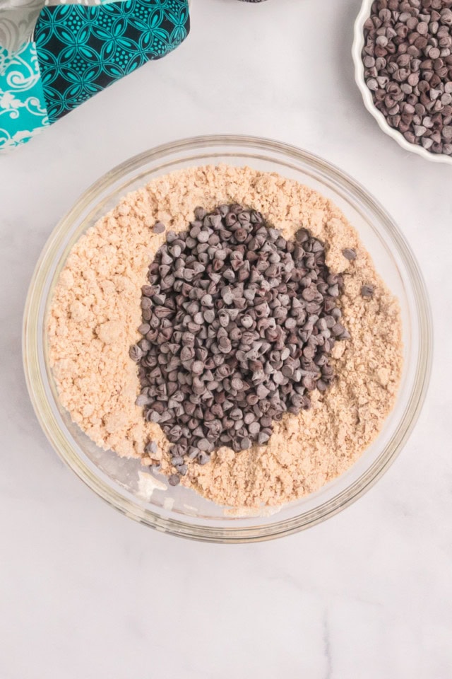 overhead view of mini chocolate chips added to crumb topping mixture