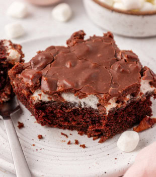 a slice of Mississippi mud cake with a bite missing