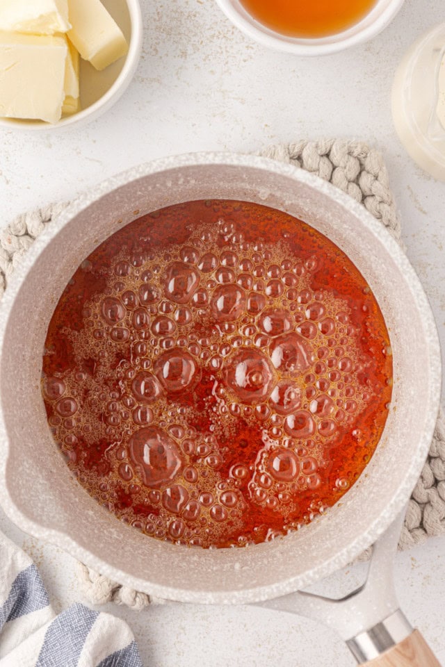 overhead view of caramel cooking in a saucepan