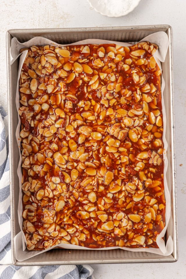overhead view of freshly baked salted caramel almond bars in a 9x13 pan