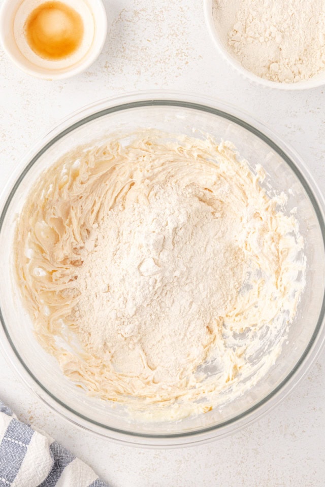 overhead view of dry ingredients added to wet ingredients for shortbread crust