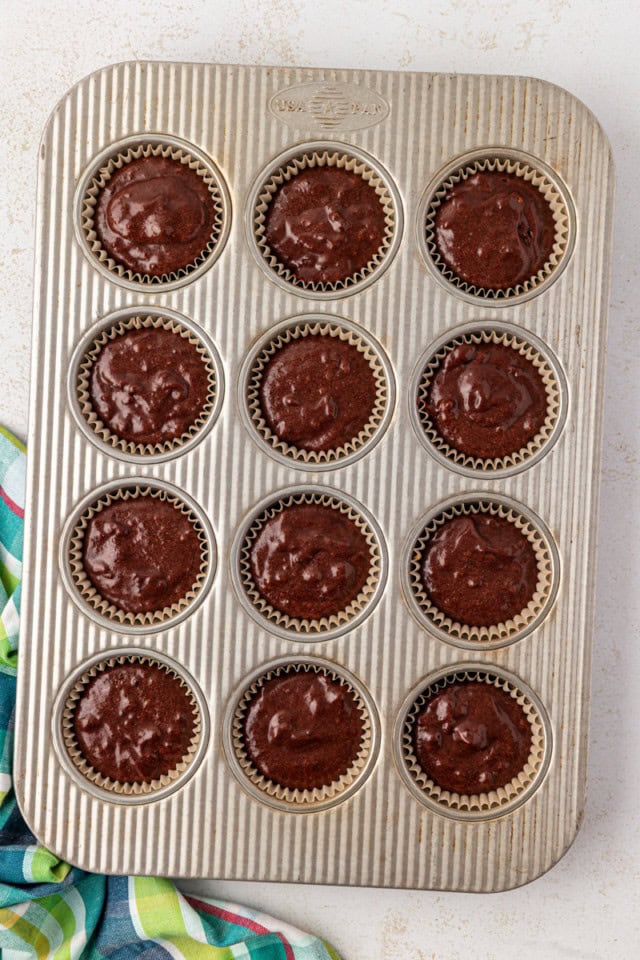 overhead view of s'mores cupcakes in a muffin pan ready to go into the oven