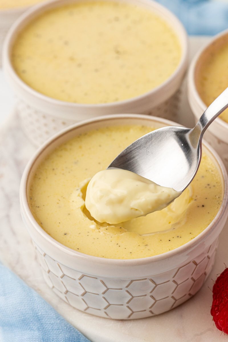 a spoonful of vanilla bean pots de crème above the remaining custard