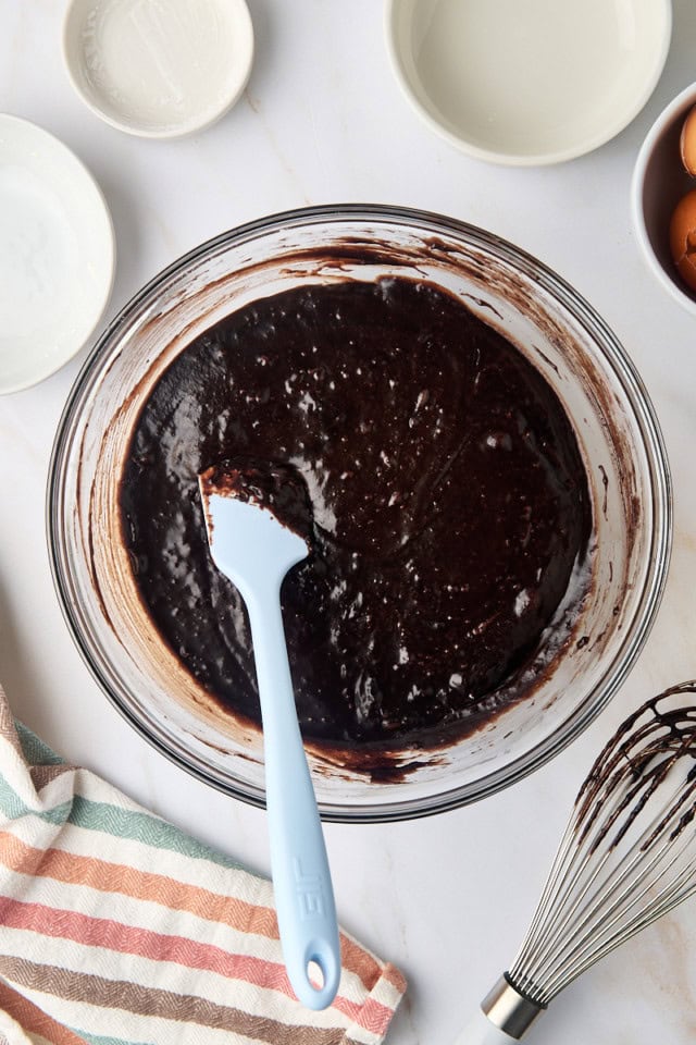 overhead view of brownie batter in a glass mixing bowl