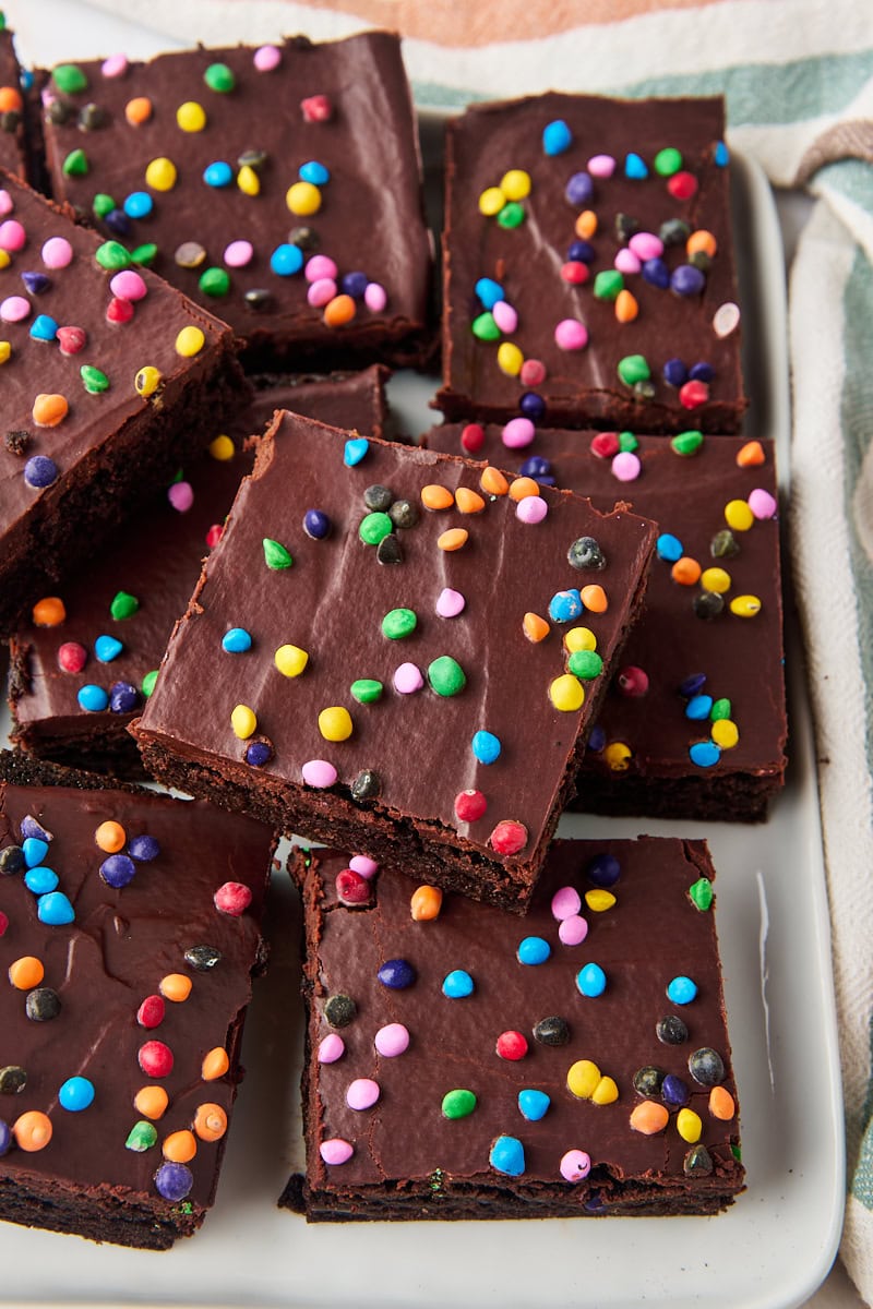 cosmic brownies in a stacked pile on a white serving plate
