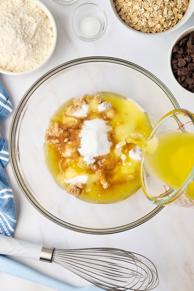 overhead view of brown sugar, sugar, and melted butter in a glass mixing bowl