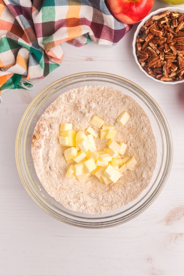 overhead view of cold, cubed butter added to crumb topping ingredients