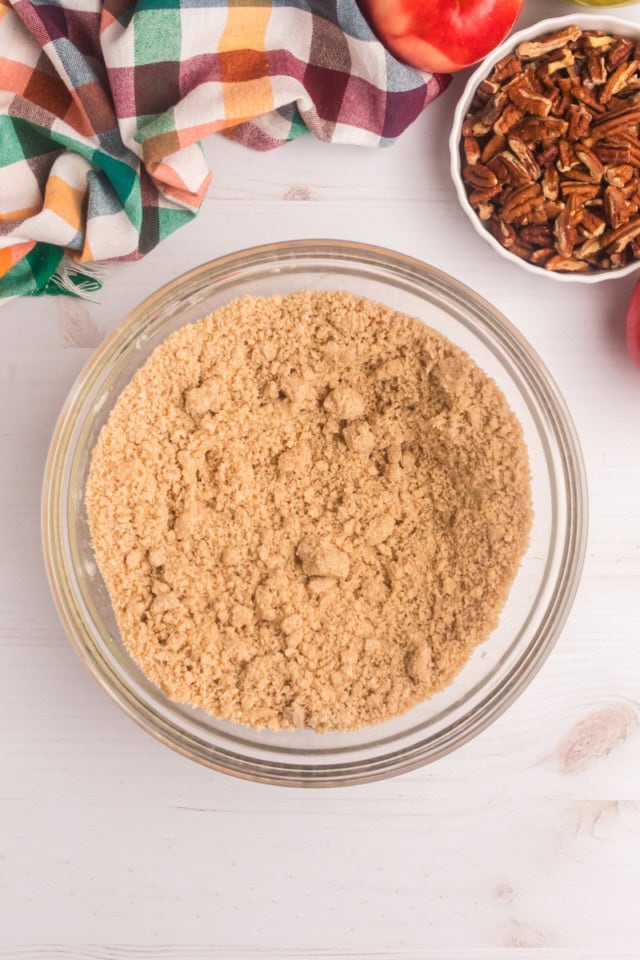 overhead view of crumb topping mixture in a glass mixing bowl