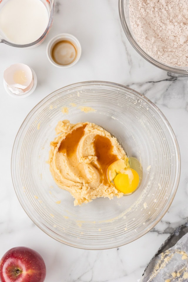 overhead view of egg and vanilla added to creamed butter and sugar