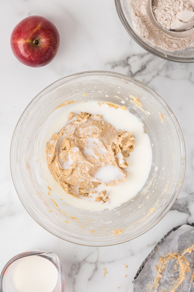 overhead view of milk added to crumb cake batter