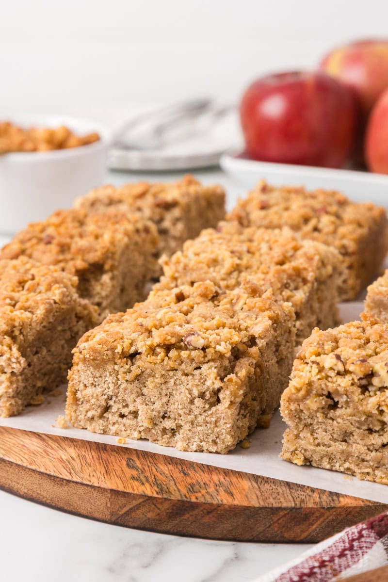 Caramel apple crumb cake squares on a serving platter for fall entertaining