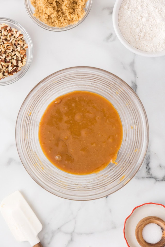 overhead view of melted caramel and butter in a glass bowl