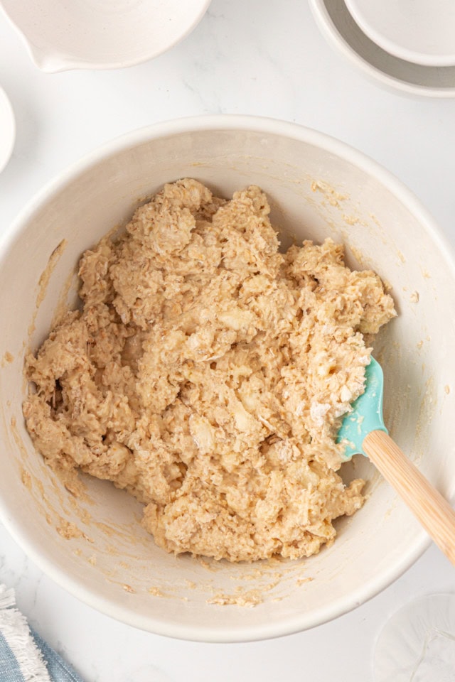 overhead view of scone dough in a white mixing bowl
