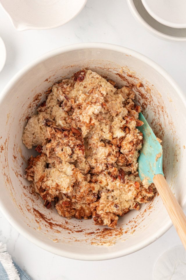 overhead view of cinnamon bun scone dough in a white mixing bowl