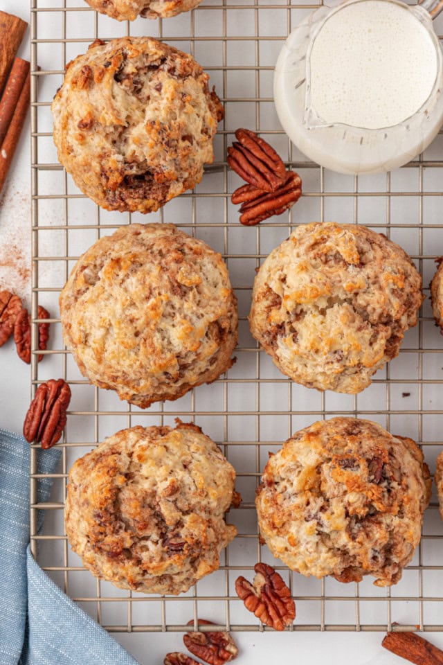overhead view of cinnamon bun scones cooling on a wire rack