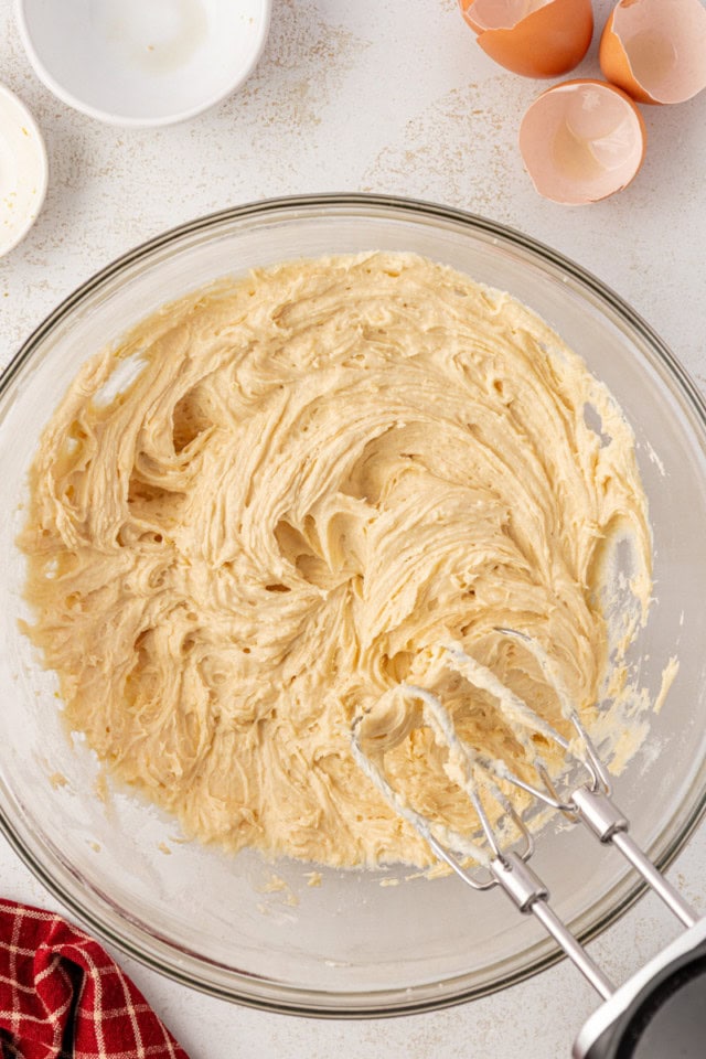 German apple cake batter in a glass mixing bowl