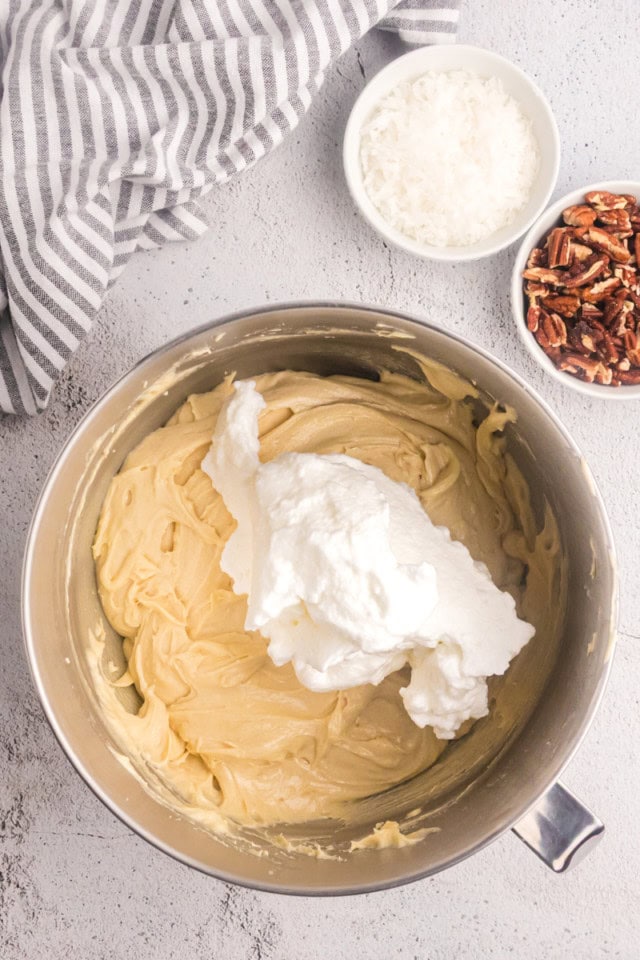 overhead view of egg whites added to Italian cream cake batter