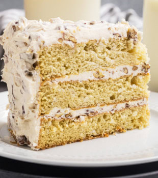 a slice of Italian cream cake on a white plate