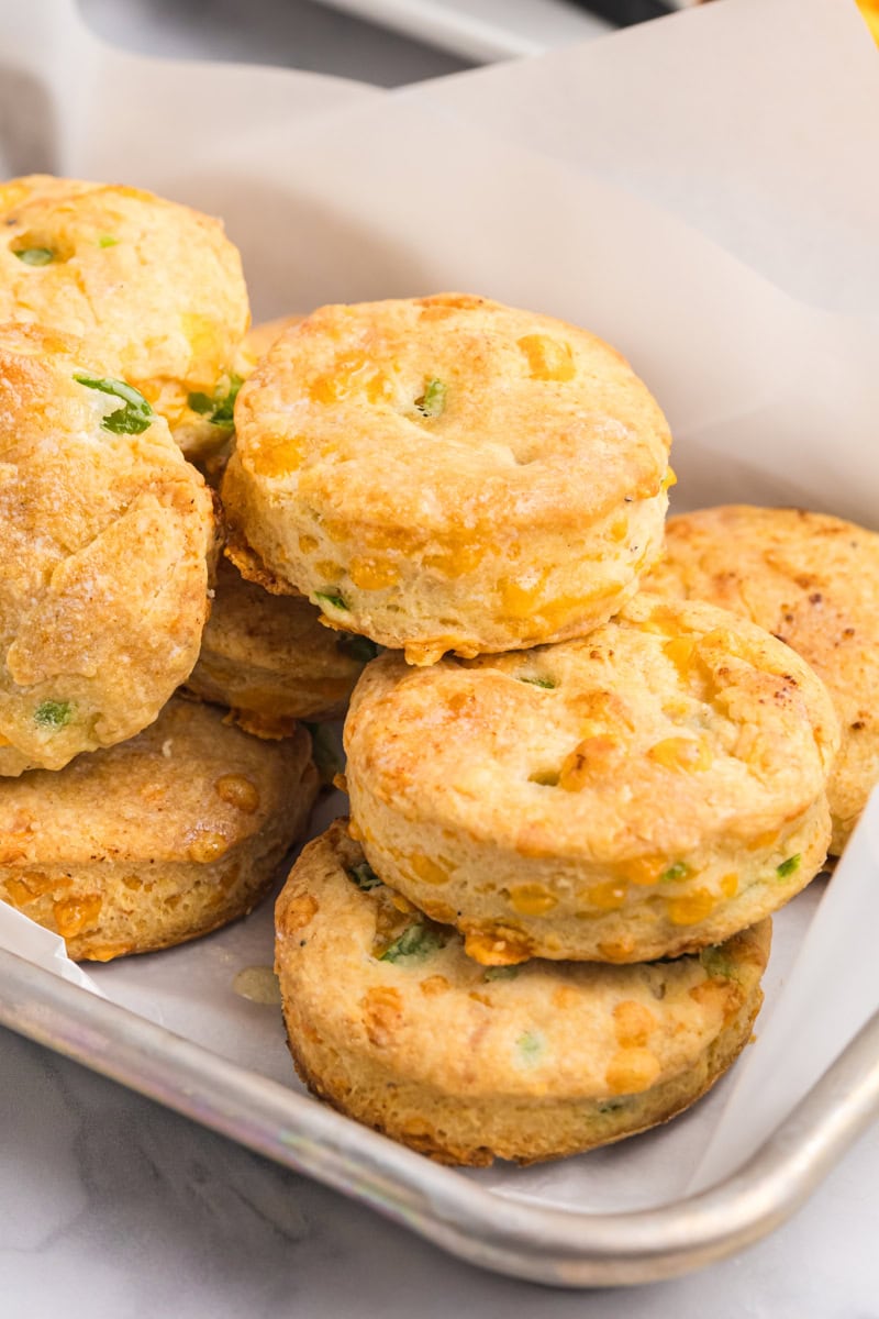 jalapeño cheddar biscuits in a lined tray