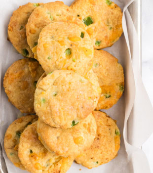 overhead view of jalapeño cheddar biscuits in a lined tray
