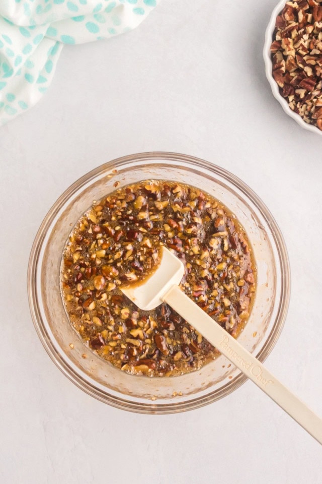 overhead view of pecan pie coffee cake topping in a glass mixing bowl
