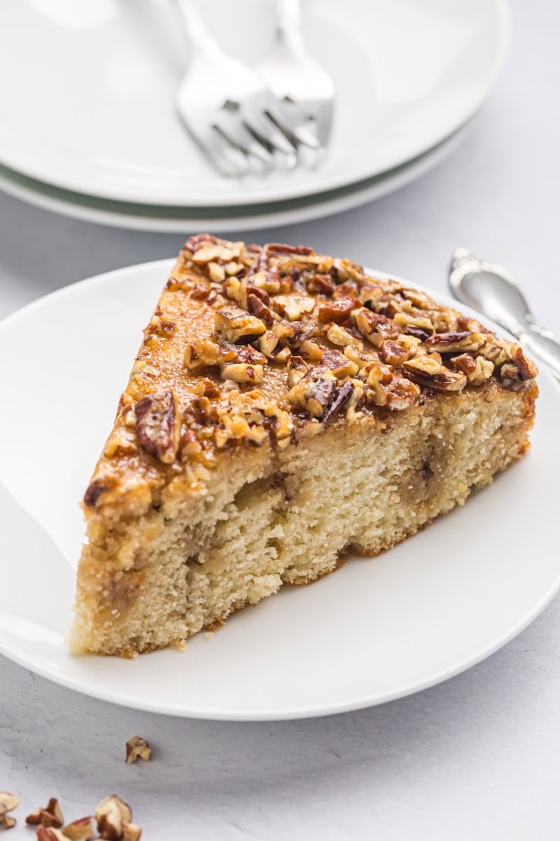 a slice of pecan pie coffee cake on a white plate