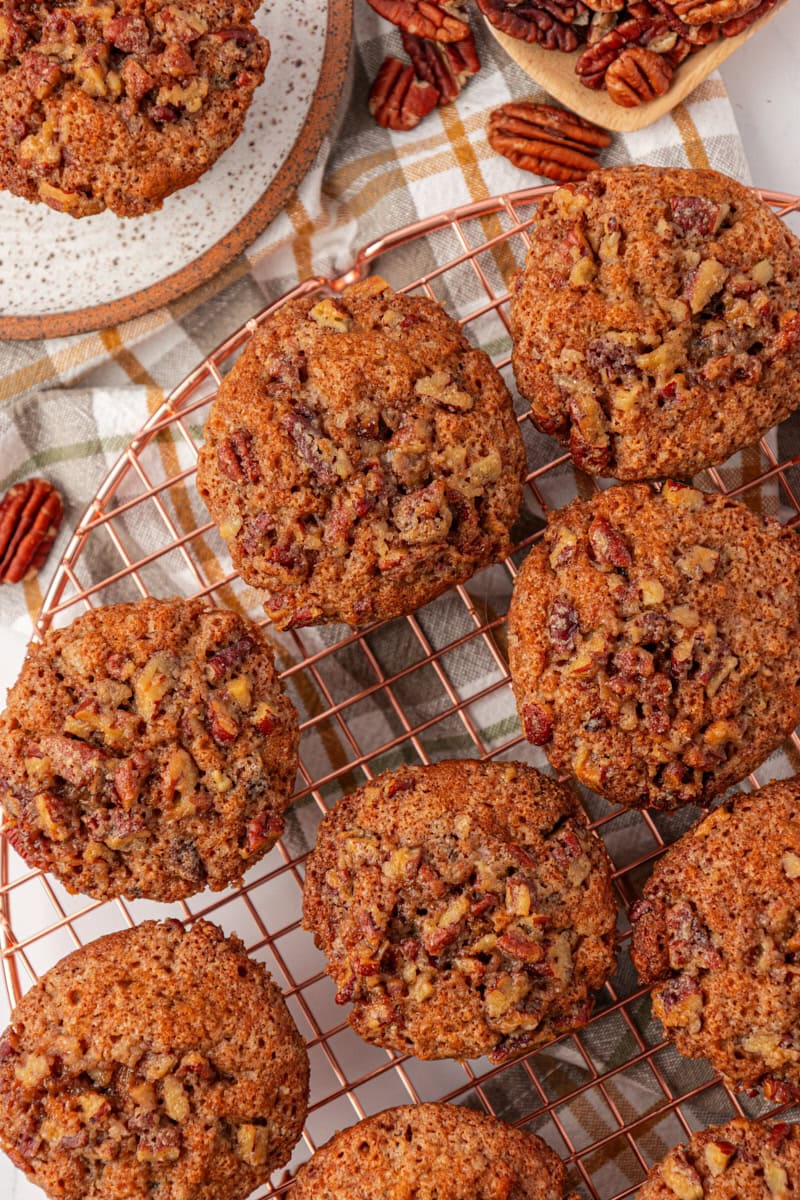 overhead view of several pecan praline muffins cooling on a wire rack