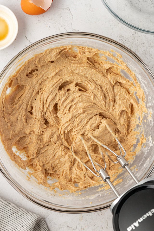 overhead view of graham cake batter in a glass mixing bowl