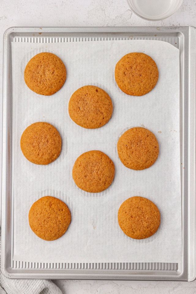 overhead view of freshly baked graham cakes on a parchment-lined baking sheet