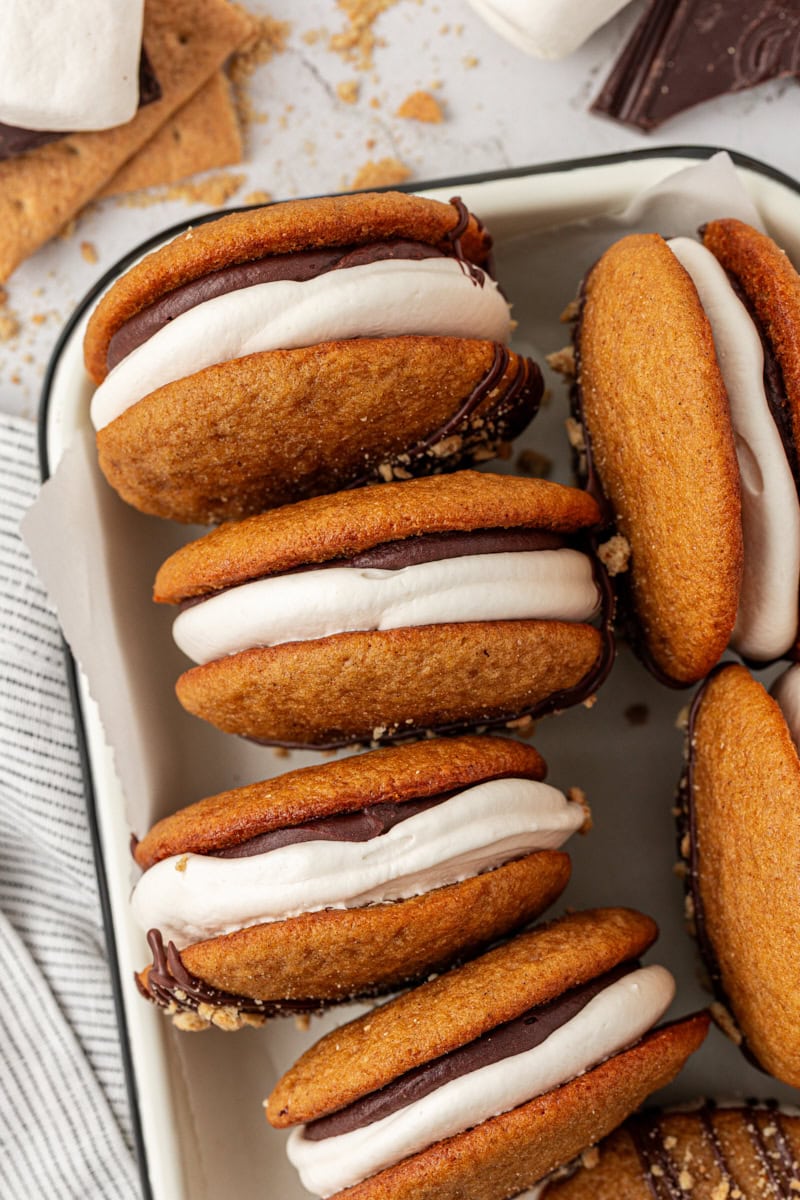overhead view of s'mores whoopie pies in a black-rimmed white tray