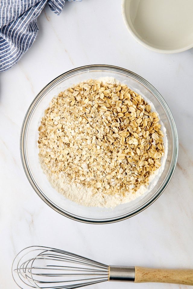 overhead view of oats added to flour mixture