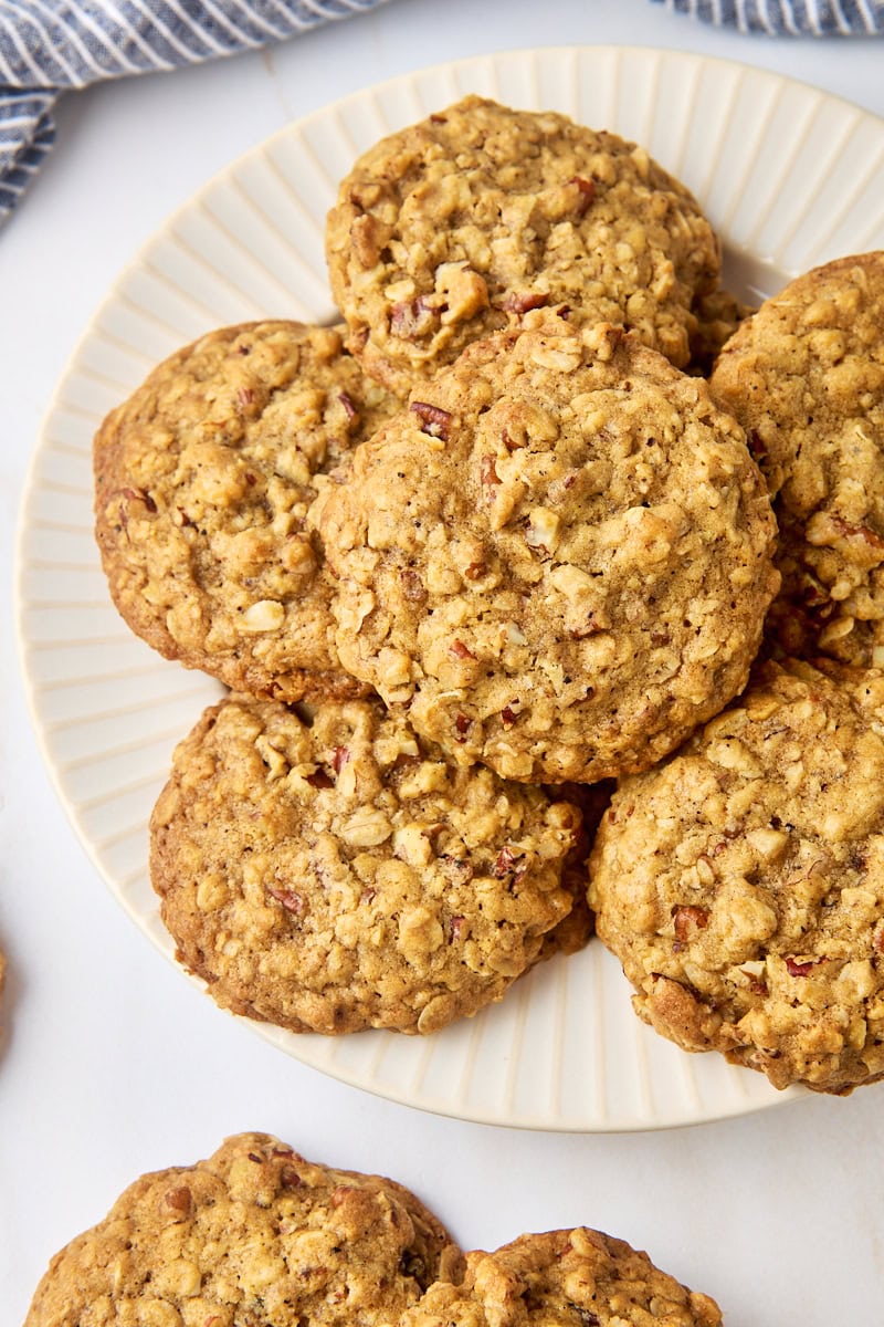 overhead view of brown butter maple oatmeal cookies on a white and beige plate